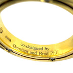 Yellow gold inner band engraving: “co-designed by Damiani and Brad Pitt”