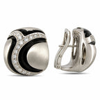 Sculpted diamond earrings with black enamel accents, showing the hinged clasp