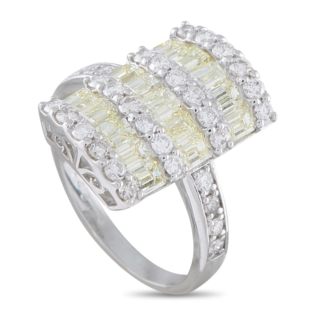 Platinum diamond ring angled view, yellow baguette center row with surrounding round stones