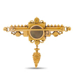 18K yellow gold antique-style brooch back featuring a round dark panel and decorative clasp