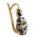 Rose gold diamond cluster drop earring, side view of round stones and prongs.