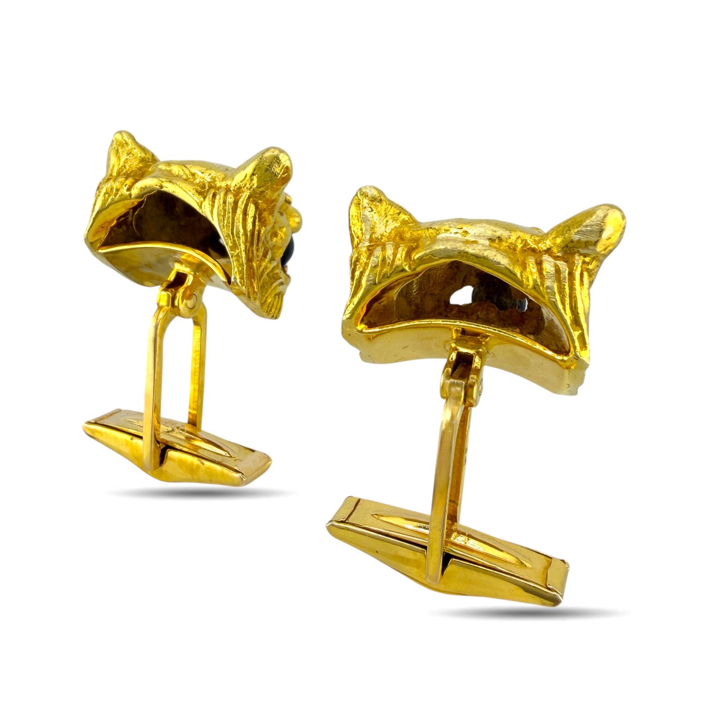 Gold panther cufflinks from side view with dark stone eyes and diamond highlights
