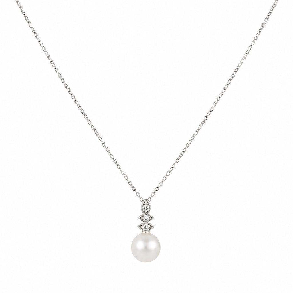 Diamond-and-pearl drop pendant necklace with a round white pearl and small diamond accents