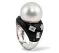 White gold ring with large pearl, black onyx face, three emerald-cut diamond accents