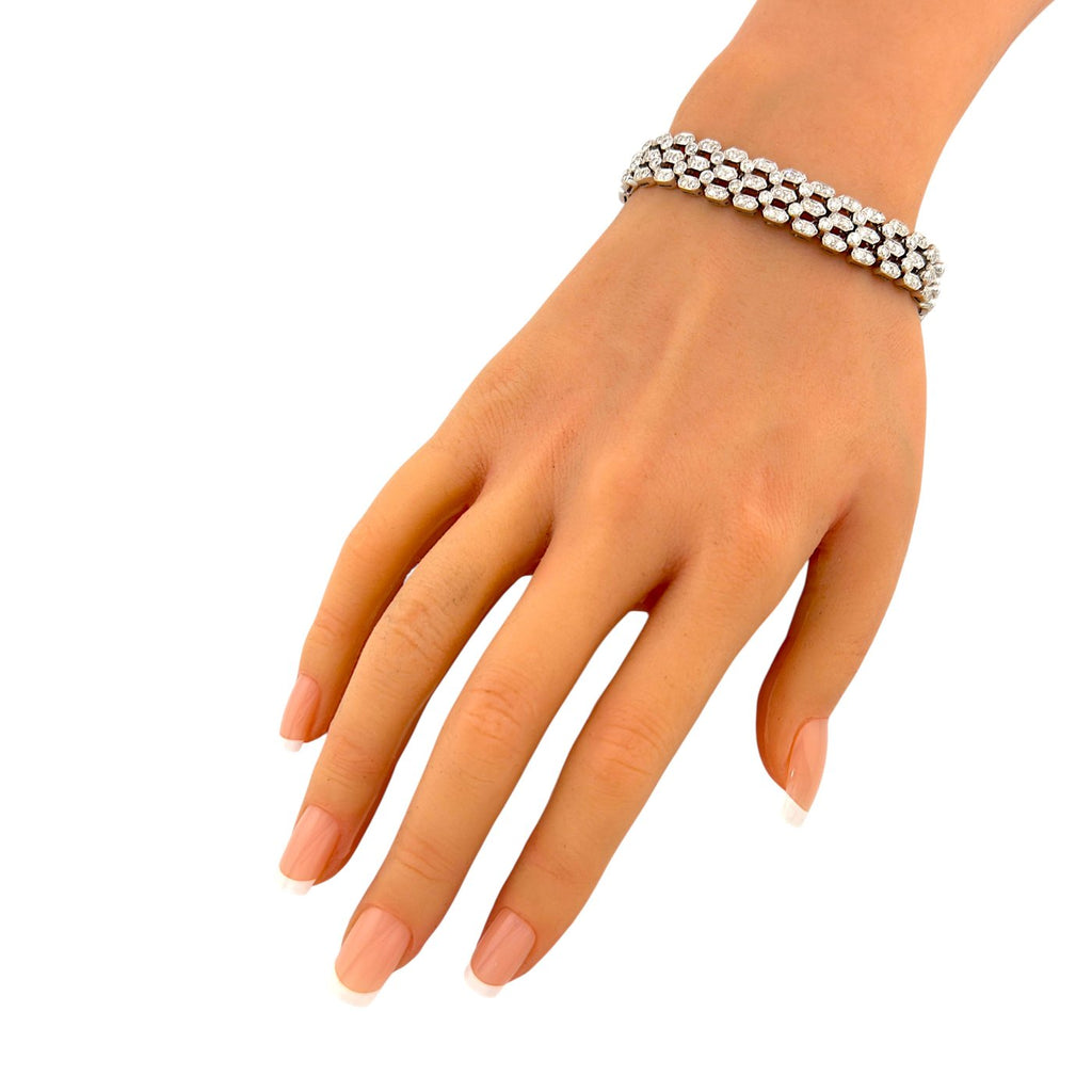 18K white gold diamond link bracelet on wrist
