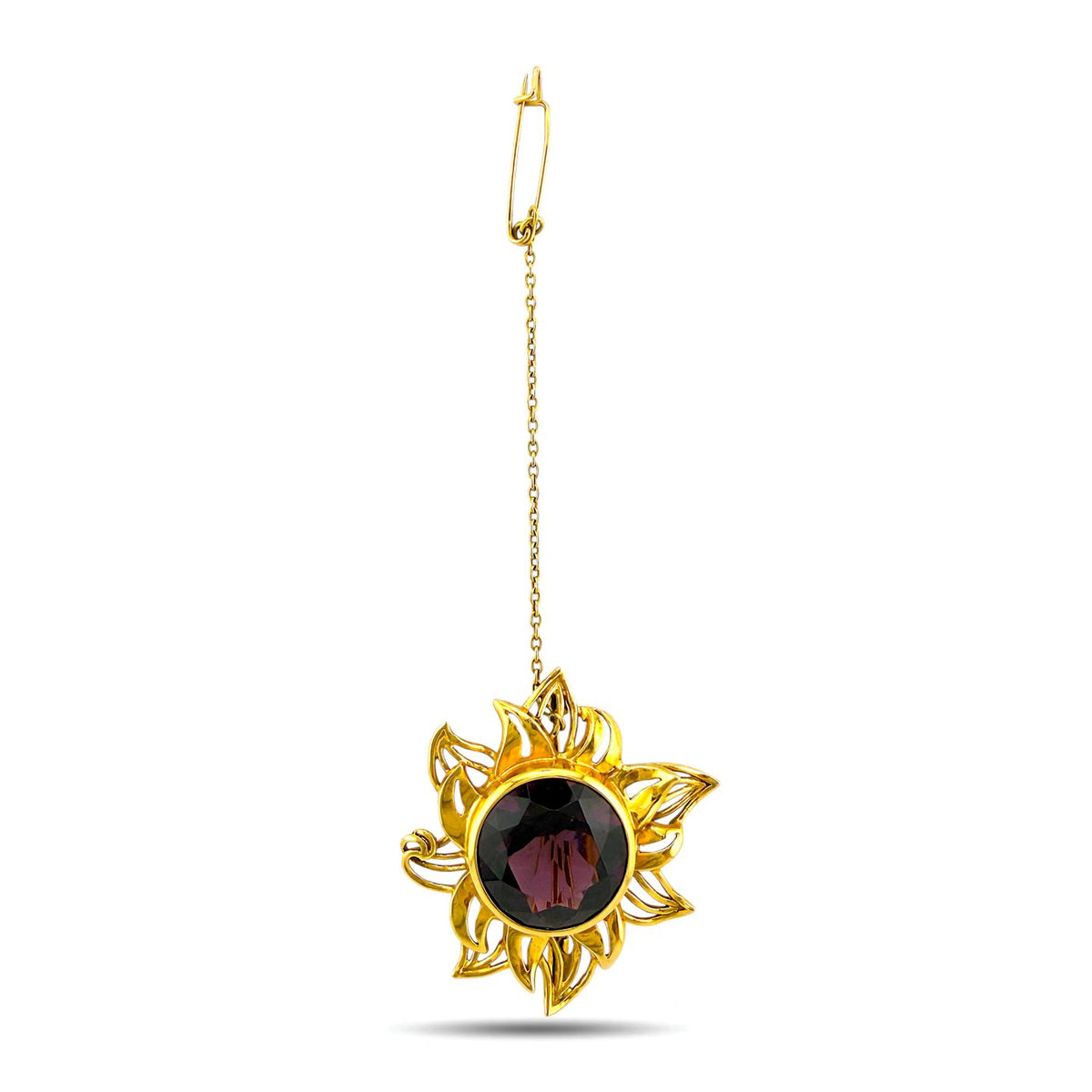 Gold sunburst brooch with round dark amethyst stone, on a chain
