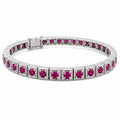 Platinum tennis bracelet with oval ruby stones and box clasp