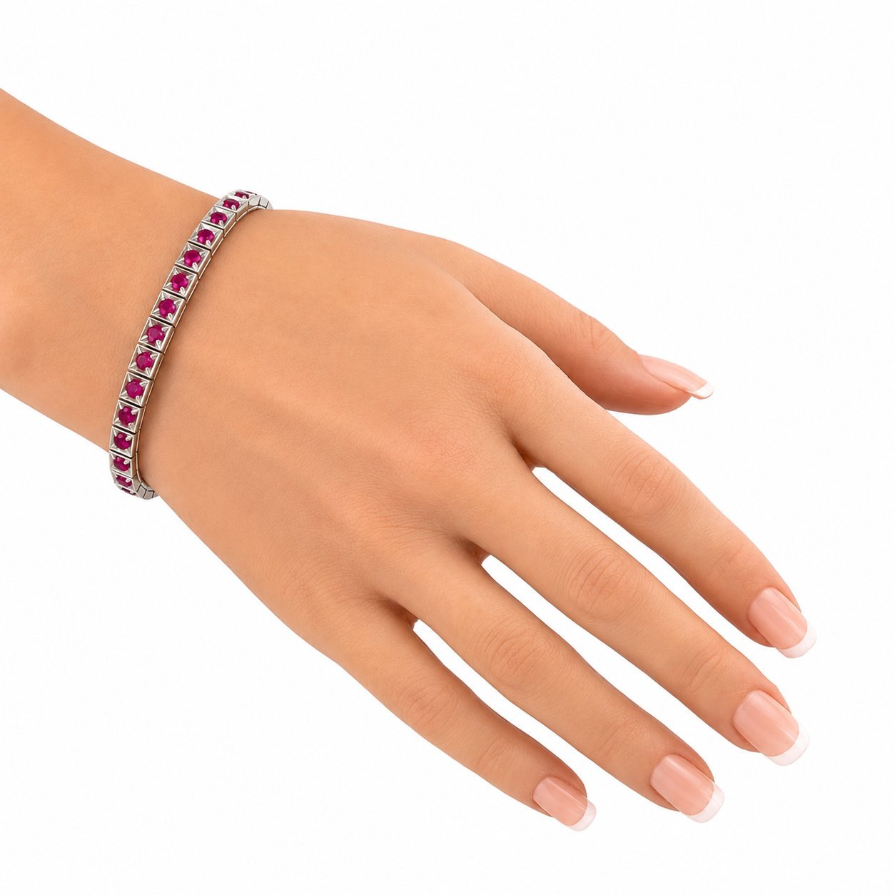 Platinum ruby tennis bracelet worn on wrist, showing clasp and stone row