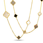 Long gold necklace featuring repeating clover charms in white mother-of-pearl and black onyx