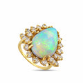 14K yellow gold ring with pear-shaped opal center and diamond halo