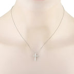 Platinum diamond cross pendant necklace on bust