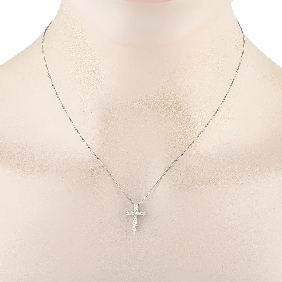 Platinum diamond cross pendant necklace on bust