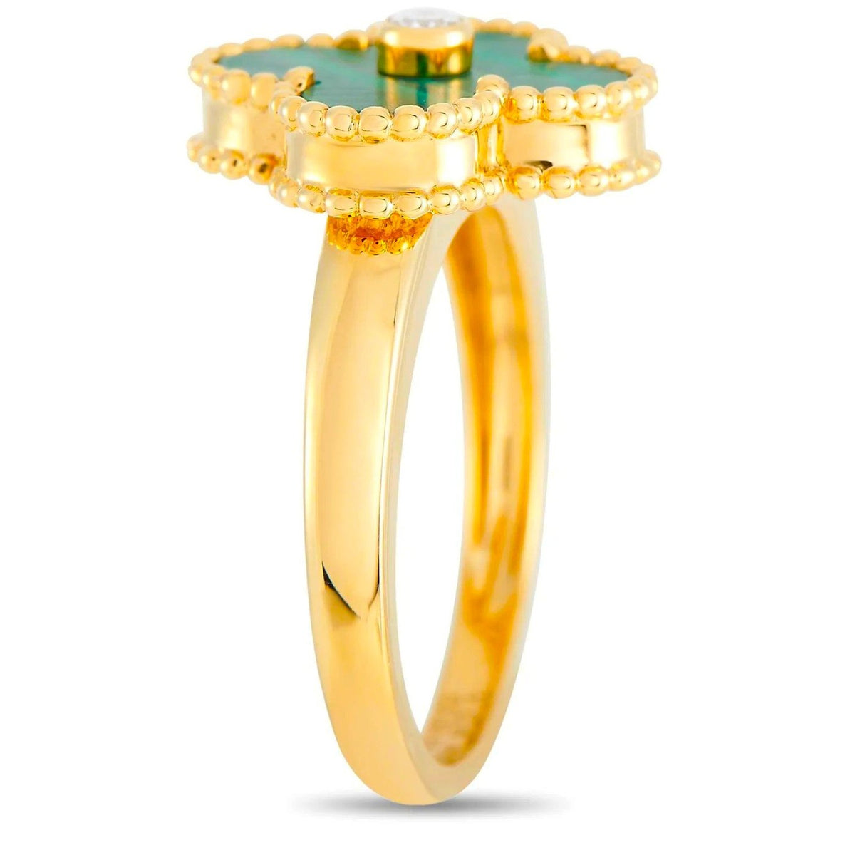 Van Cleef & Arpels ring side view showing the yellow gold band and raised clover setting