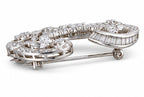 18K white gold diamond brooch with hinged frame and visible pin clasp.