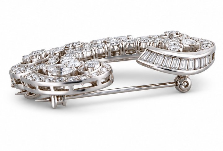 18K white gold diamond brooch with hinged frame and visible pin clasp.