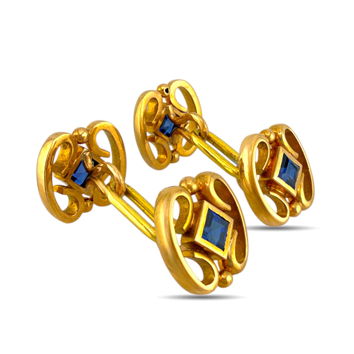 Gold sapphire cufflinks shown from an angled side view, revealing their connecting bars