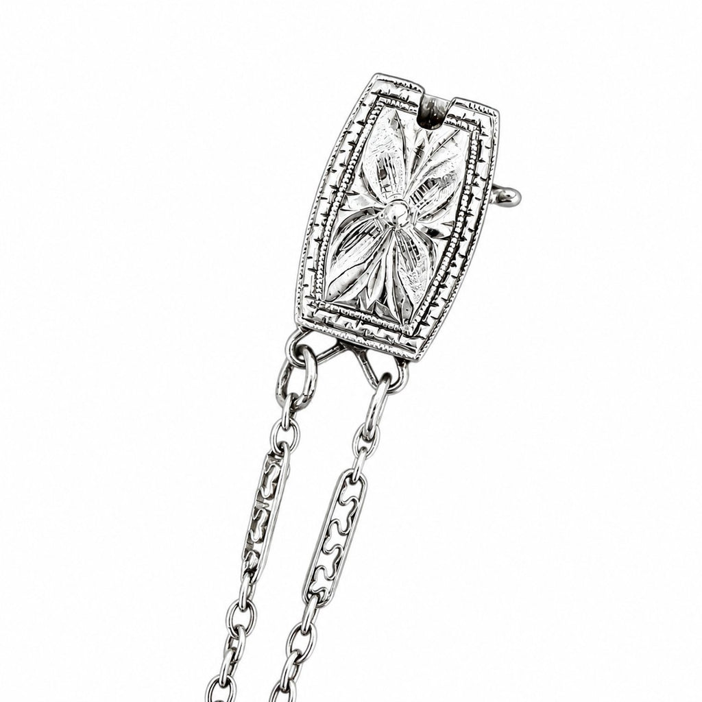 Round diamond halo pendant detail with connected chain links, 18K white gold
