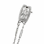 Round diamond halo pendant detail with connected chain links, 18K white gold