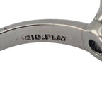 Close-up of engraved inner band reading TIFFANY on a platinum solitaire ring