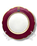 Armorial plate with maroon rim, gold edge, and coat of arms crest at the top