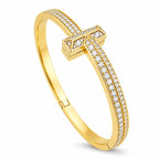 Tiffany & Co. 18K yellow gold hinged bracelet with diamond T motif