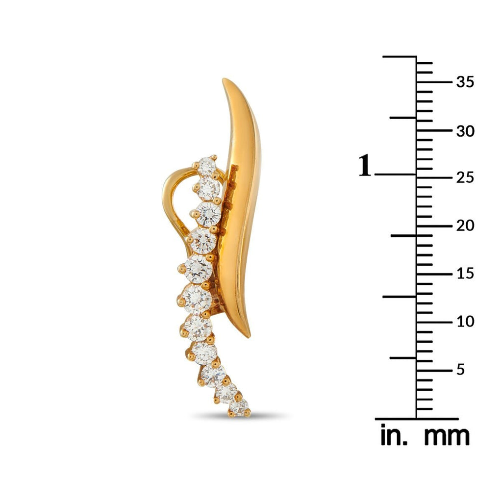Yellow gold clip-on earrings with round diamond row, shown next to an in. mm ruler.