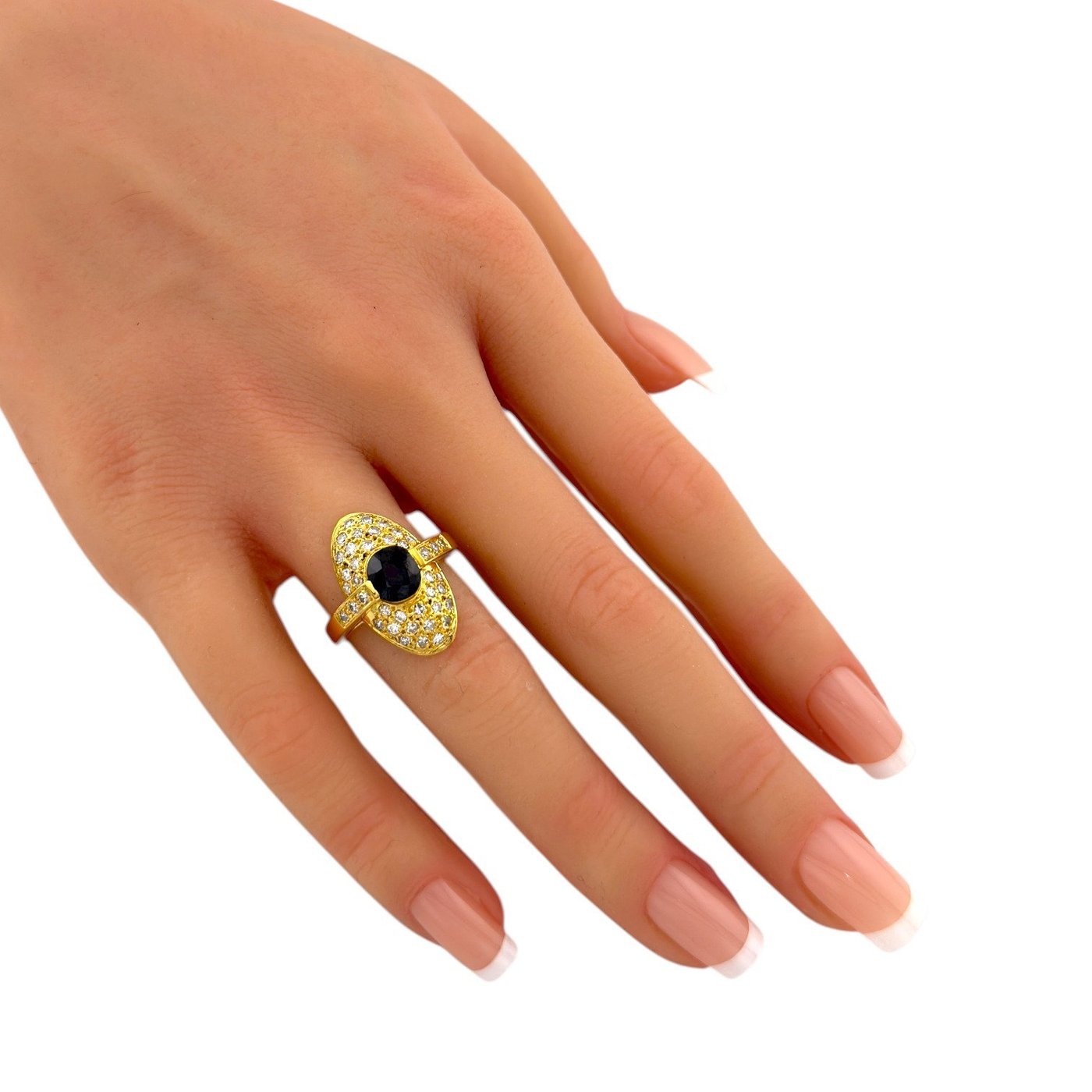 18K yellow gold ring with oval dark center stone and diamond halo