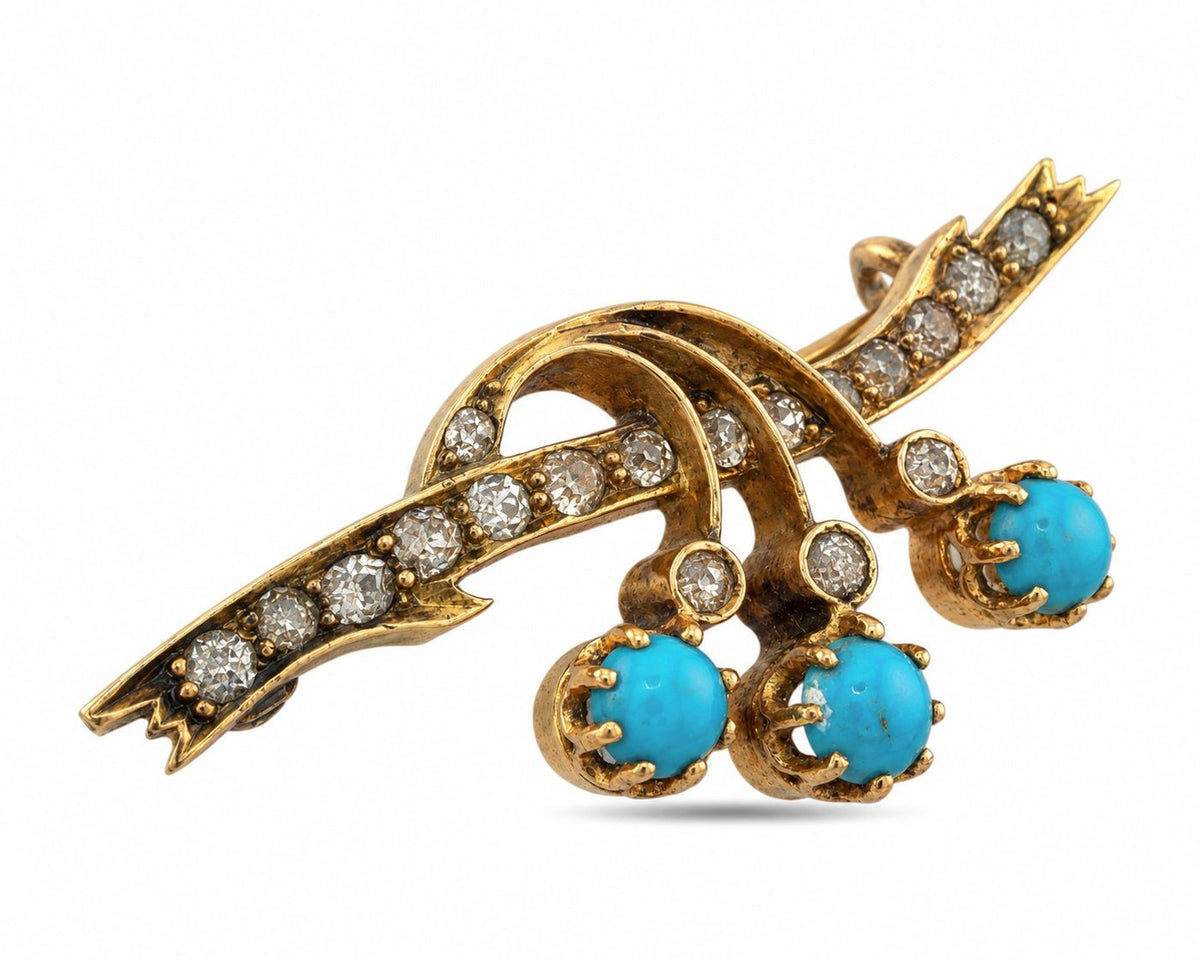 Angled view of a rose gold brooch with diamonds and three turquoise drops