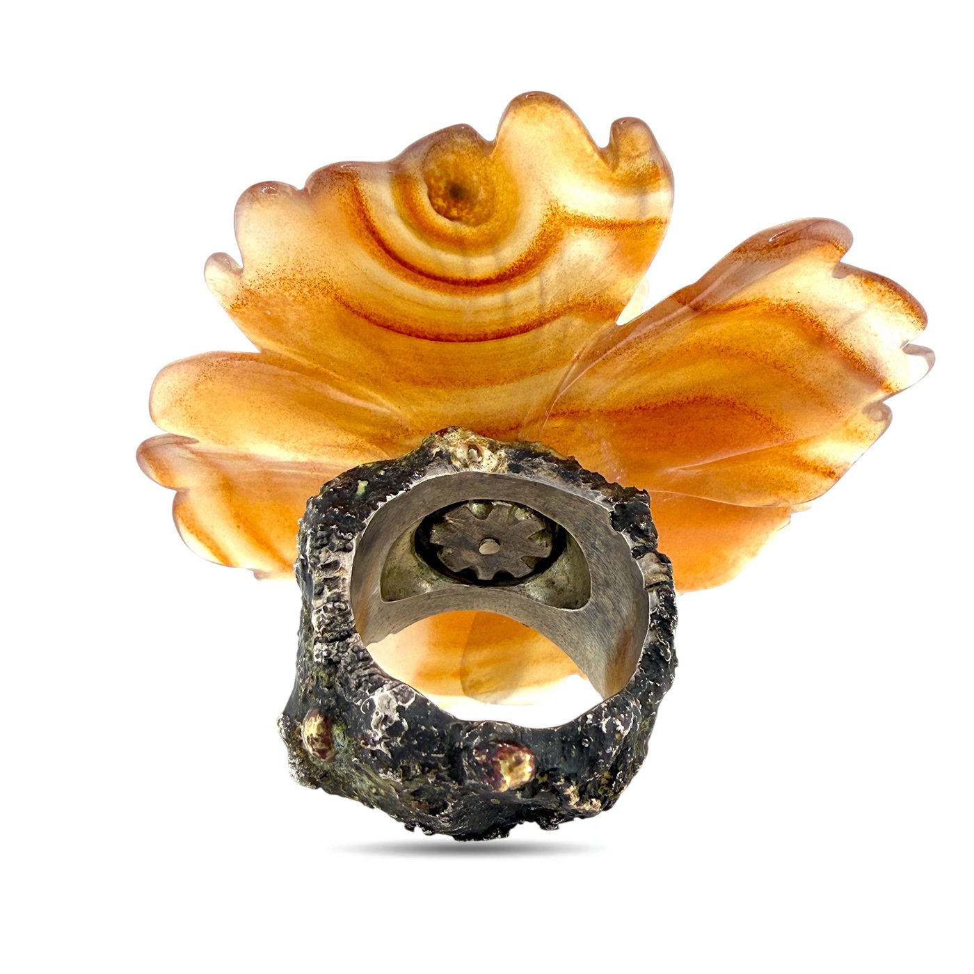 Amber floral ring top with dark metal band and visible ring setting