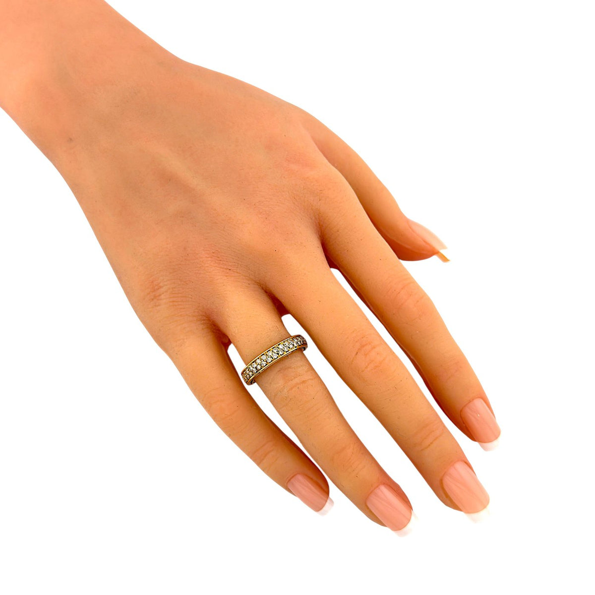 Damiani x Brad Pitt yellow gold diamond ring on a hand