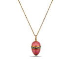 Pink enamel egg pendant with gold tone chain, topped with small round gemstone detail.
