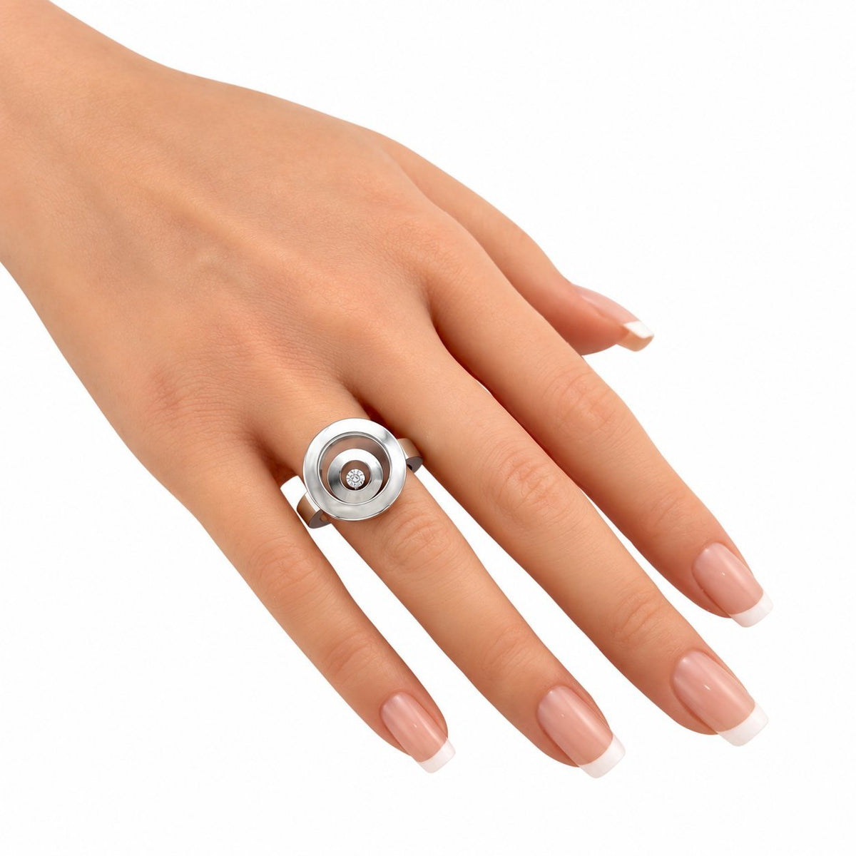 White gold floating diamond ring on hand, circular bezel with round center stone