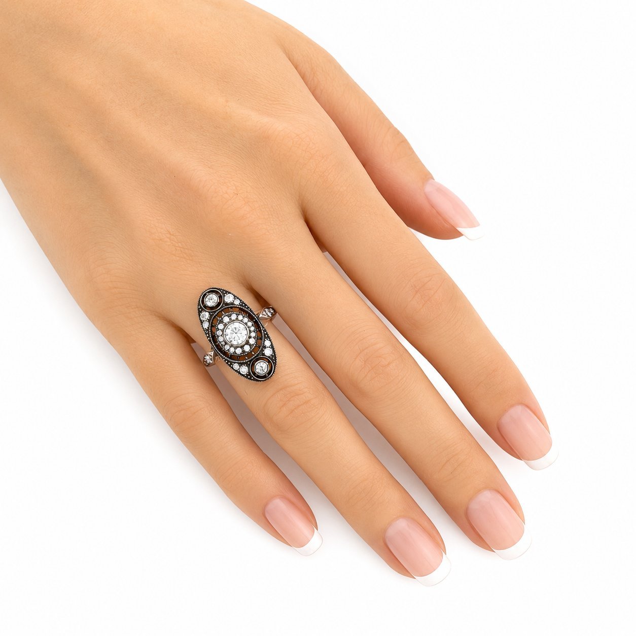 Rose gold diamond ring with black setting, worn on hand, oval center stone