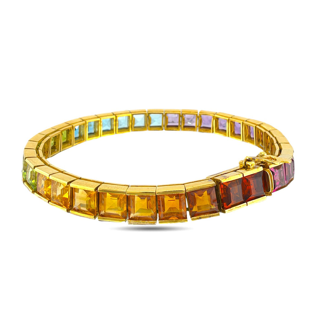 18K yellow gold rainbow gemstone bracelet with orange, red, blue, and green stones
