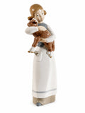 Porcelain figurine: girl holding a brown lamb on a white base