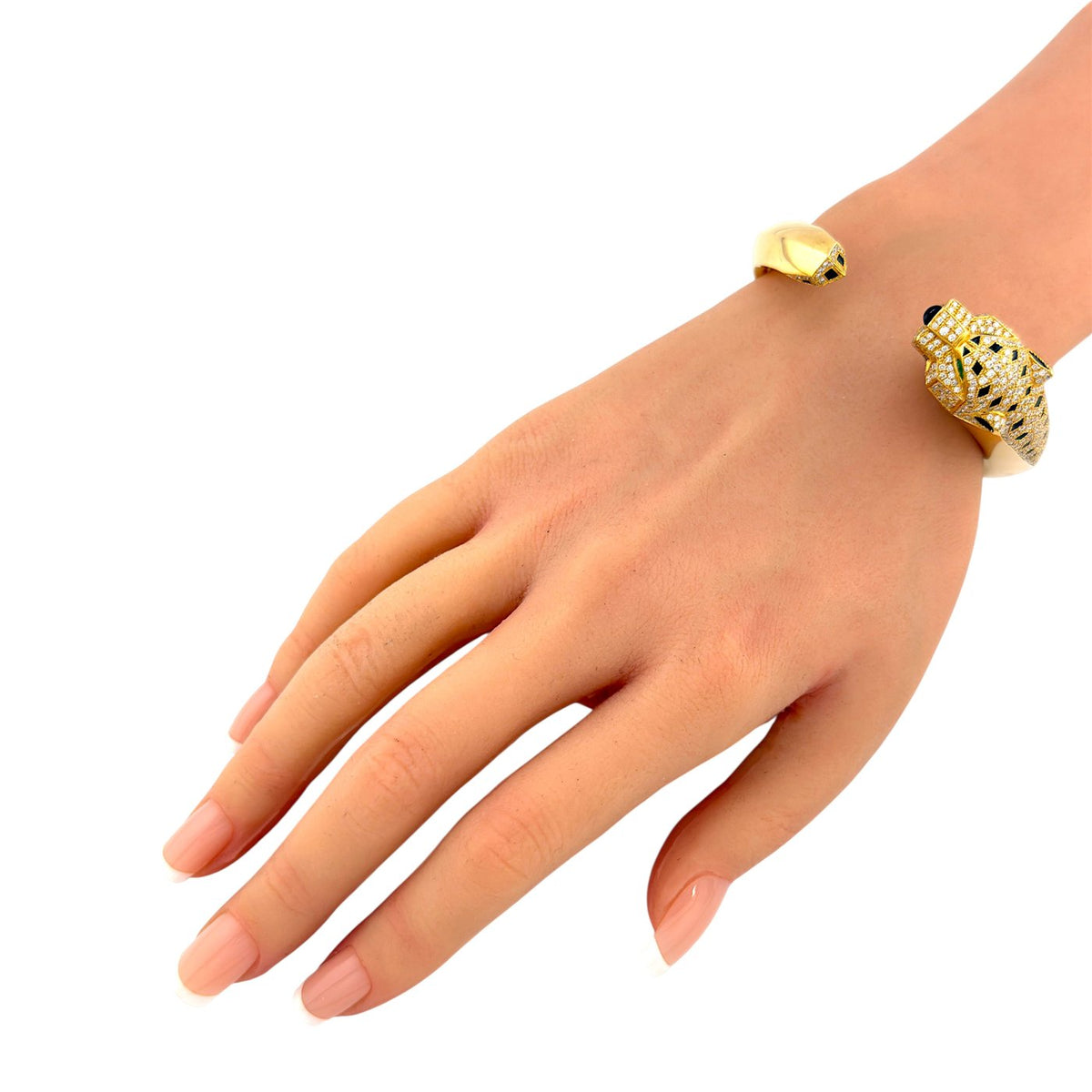 Cartier Panthère de Cartier yellow gold panther bangle on a wrist