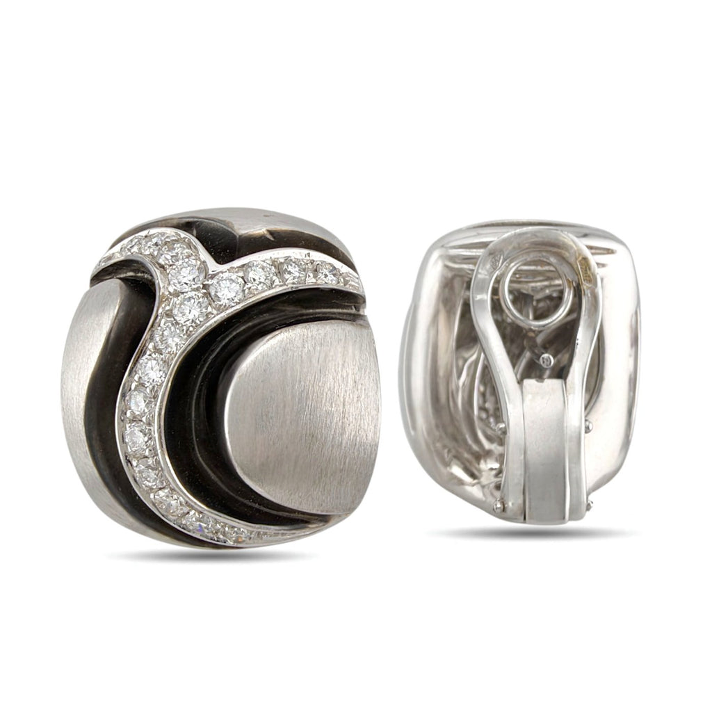 Diamond and black enamel earring with the back and clip clasp visible
