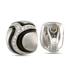 Diamond and black enamel earring with the back and clip clasp visible