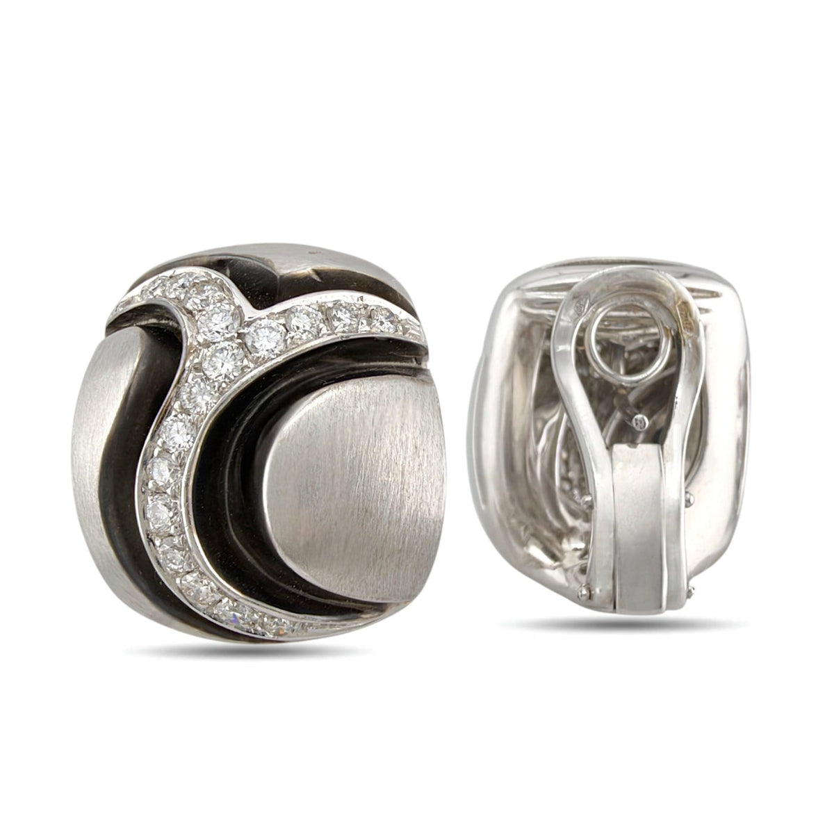 Diamond and black enamel earring with the back and clip clasp visible