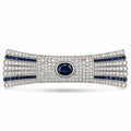 Art deco diamond and sapphire bar brooch with oval blue center stone and blue striped accents