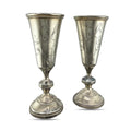 Antique silver cup pair with engraved floral design and fluted stem bases