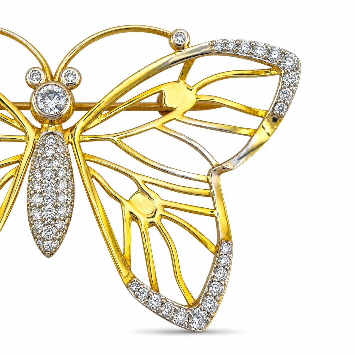 Close-up of the brooch's openwork wing, gold ribs, and diamond-set edges