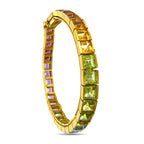 18K yellow gold rainbow gemstone tennis bracelet shown upright, with visible clasp