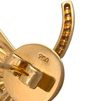Close-up of earring post and round back stamped 18K