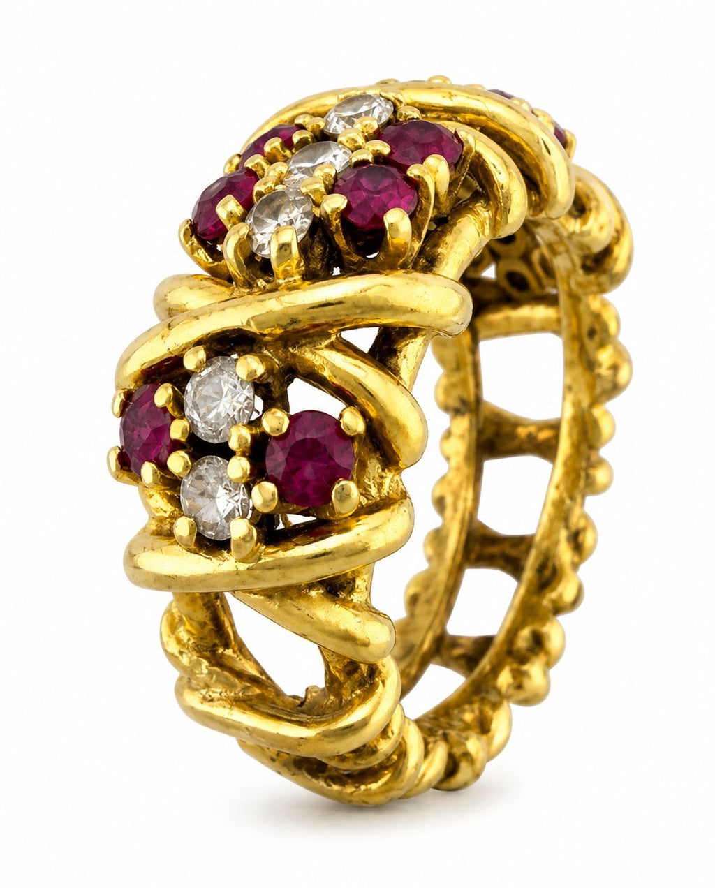 Vintage gold ring with ruby and diamond oval cluster settings, close side view