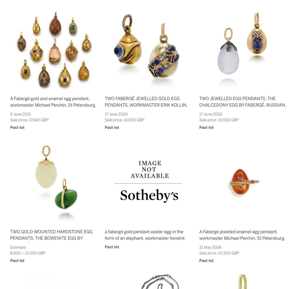 Multiple gold and enamel egg pendants with blue, green, and red gemstone accents