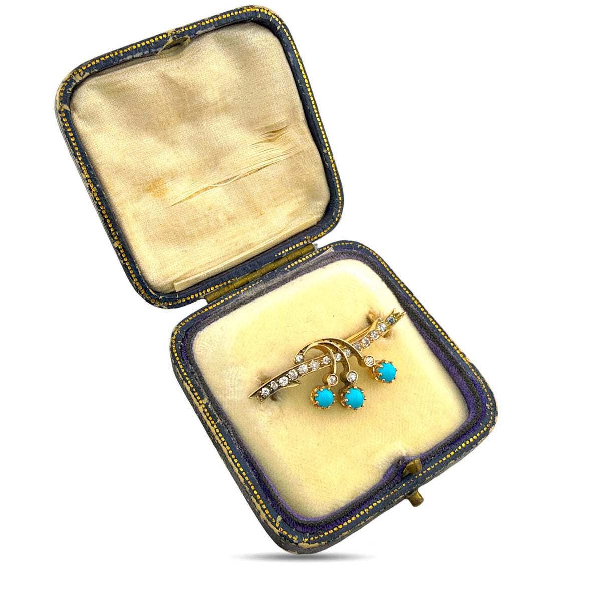 Diamond and turquoise brooch displayed in its fitted presentation case