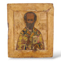 Antique Russian icon of St. Nicholas, seated bishop figure in gold and red robes