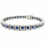Platinum sapphire tennis bracelet with blue stones set across a slim silver link band