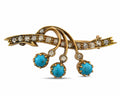 Rose gold brooch with diamond-set swirls and three turquoise drops